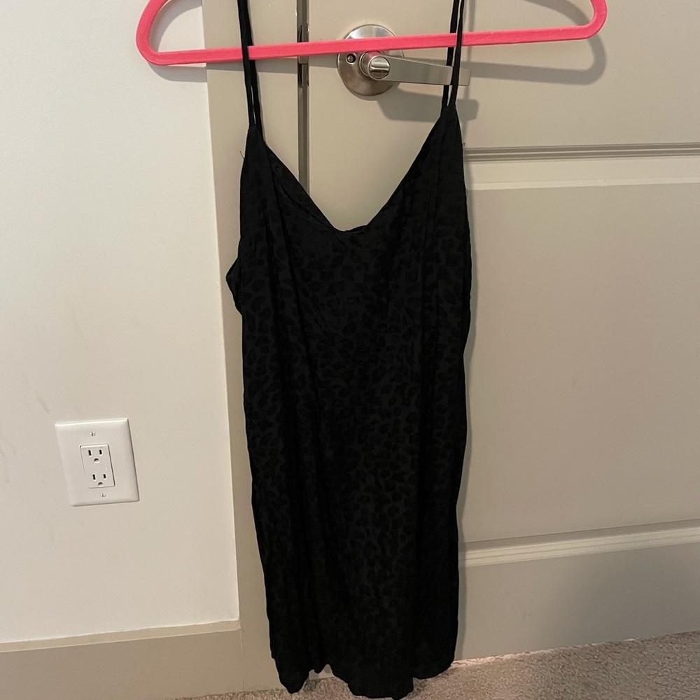 Cheetah print black mini slip dress. NEVER WORN. Size medium.